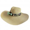 Sombrero de ala ancha con banda bicolor y trenzado con dijes bordados