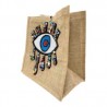 Bolsa cuadrada de yute con parche de ojo bordada a mano con dijes