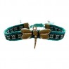 Pulsera con dije de libélula ajustable sobre cinta bordada oaxaqueña